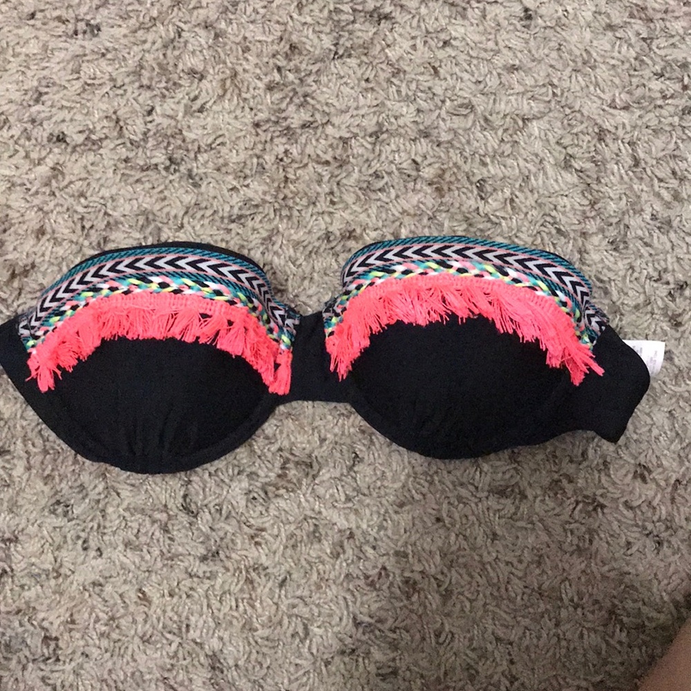 Various bathing suit tops and one bottom piece
